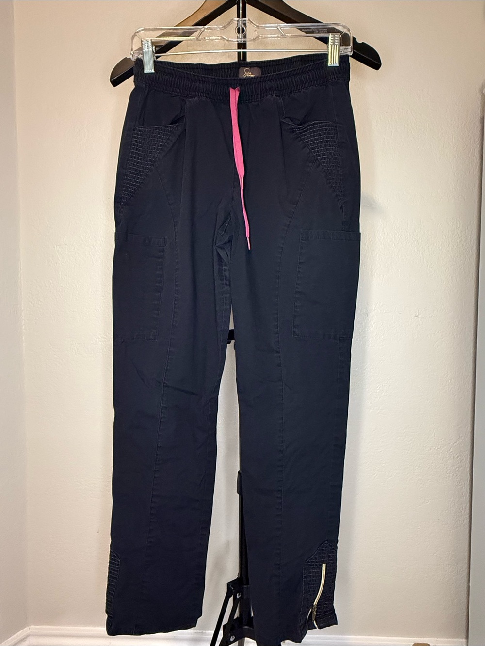 Jaanuu Shanti Black Scrub Joggers with Gold Logo Detail